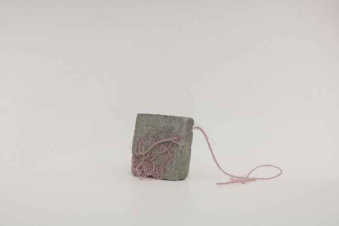 Sara Al Haddad, for self destruction #13, 2014, concrete_5.4x2.1x6cm, concrete and free form crocheted embroidery thread. Photo: Marwah Al Haddad