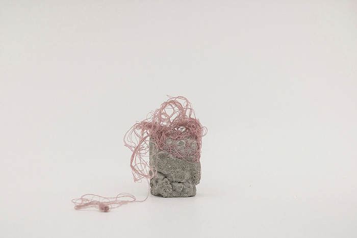 Sara Al Haddad, for self destruction #17, 2014, concrete_3.3x3x5.2cm, concrete and free form crocheted embroidery thread. Photo: Marwah Al Haddad