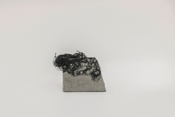 Sara Al Haddad, for self destruction #19, 2014, concrete_8.2x2x6.4cm, concrete and free form crocheted embroidery thread. Photo: Marwah Al Haddad