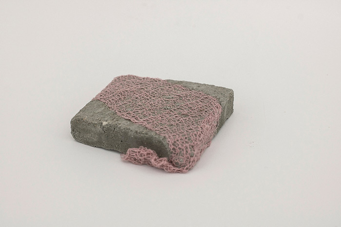 Sara Al Haddad, for self destruction #32, 2014, concrete_6.9x6.7x1.6cm, concrete and free form crocheted embroidery thread. Photo: Marwah Al Haddad